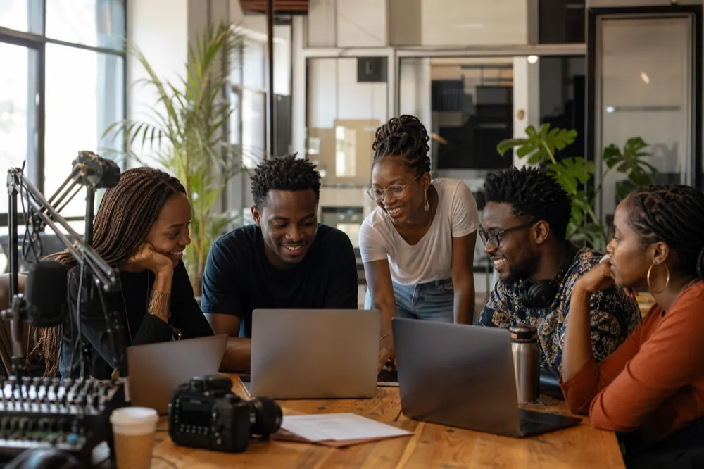 African creative team collaborating at Live54+